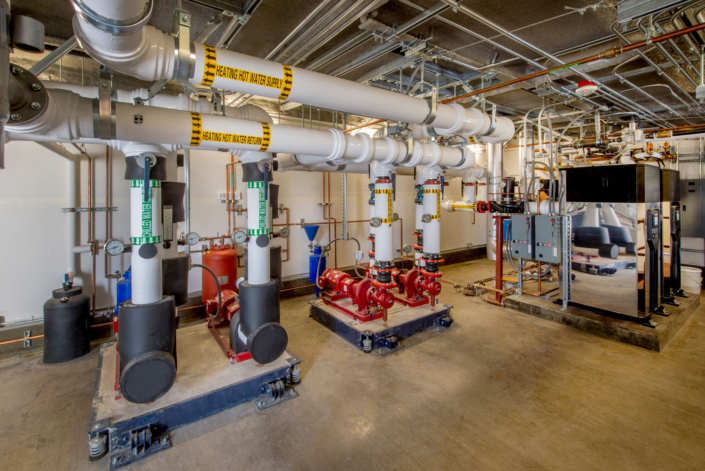 Boiler Room Boiler room with water circulating pumps and associated plumbing.